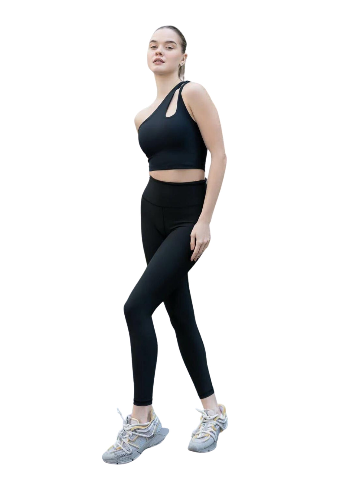 Person im 388 Sevres Sport Bustier von Lismina in Schwarz, posiert vor einem weißen Hintergrund, bereit für Yoga.