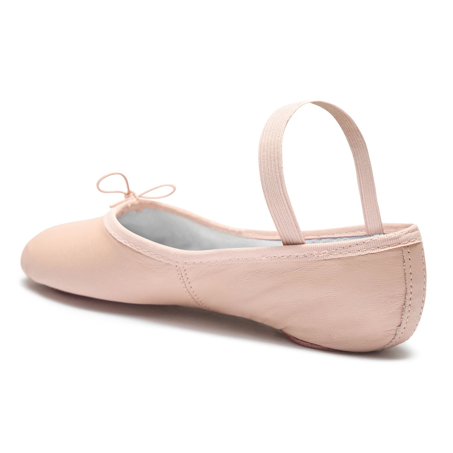 Rumpf 1003 Ballettschläppchen Leder in Rosa mit Gummiband und Schleife, Seitenansicht auf weißem Hintergrund.