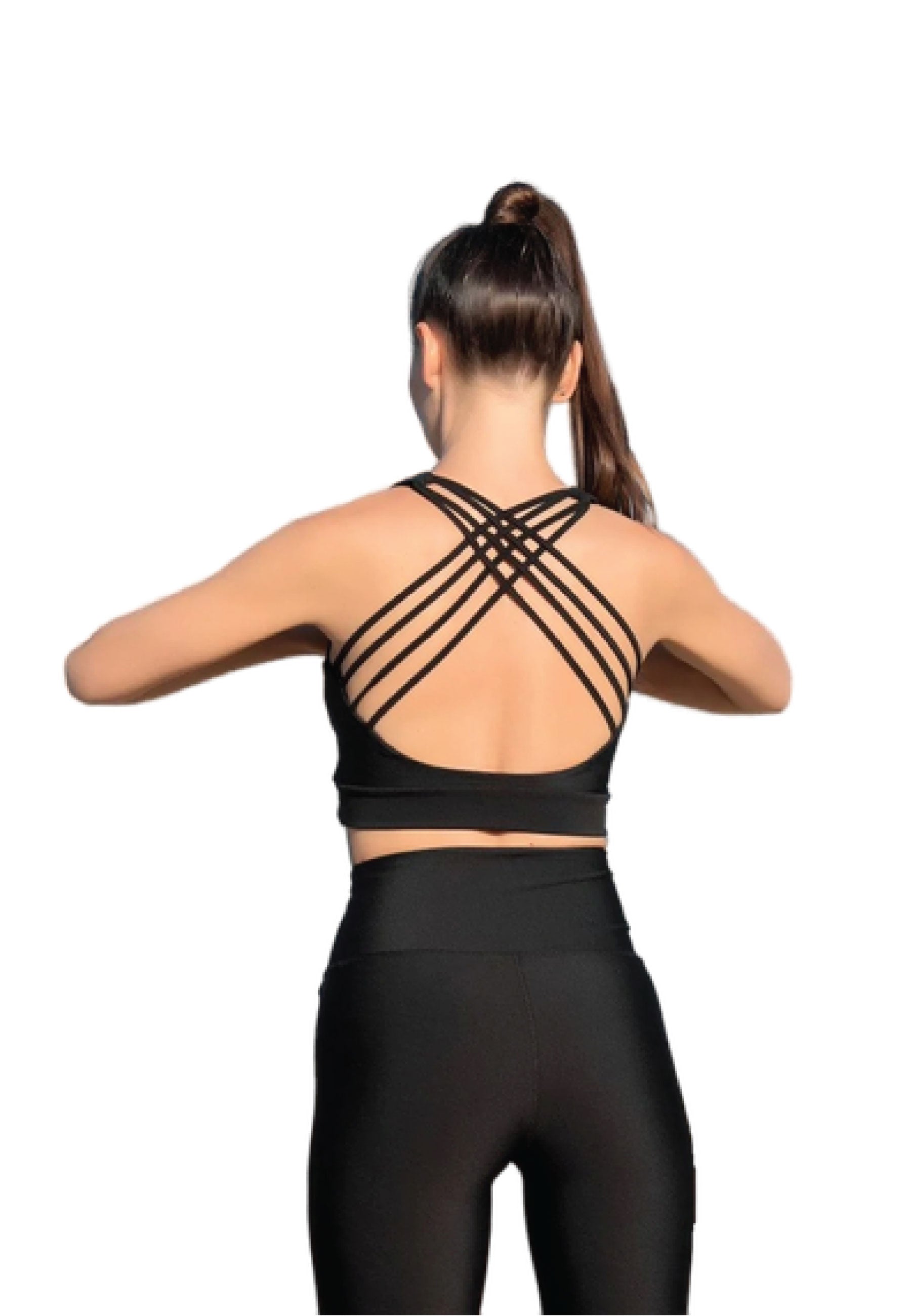Person in Lisminas 188 Schwarzes Sport-BH mit gekreuztem Rücken und Leggings, von hinten auf Weiß gesehen.