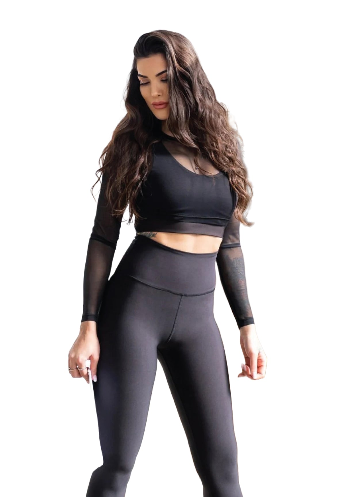 Eine Person in Lisminas 249 Winter High Waist Leggings in Schwarz, mit welligem Haar, bereit für Outdoor-Sport.
